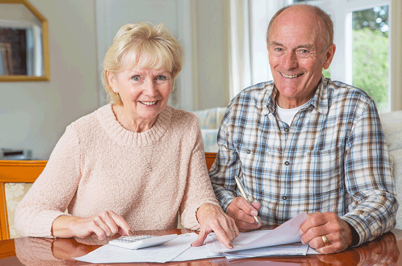 Couple planning their retirement and dicussing how much do i need to retire